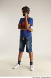 TIMBO STANDING POSE WITH GUN